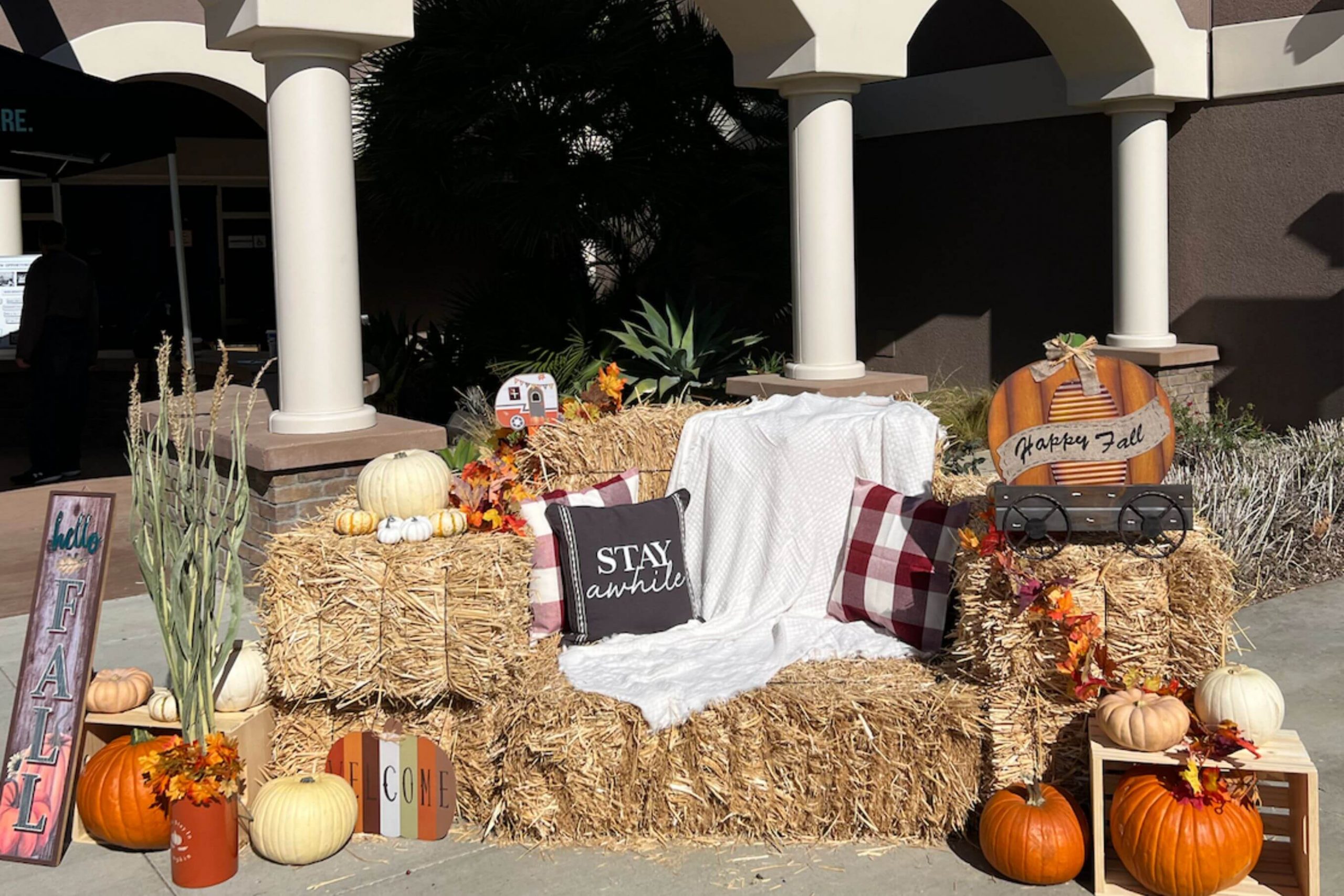 haybale and pumpkins made into seating area